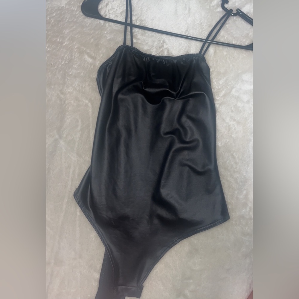 leather body suit, clip buckle